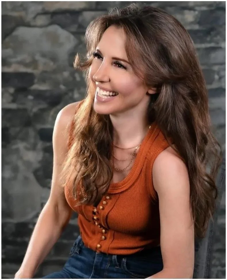 Amanda Kasmira “Kazzy” Cryer — rust-colored editorial portrait
